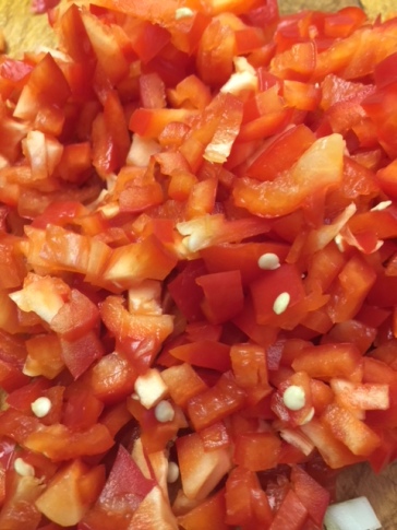 Chopped red peppers. Discard seeds.